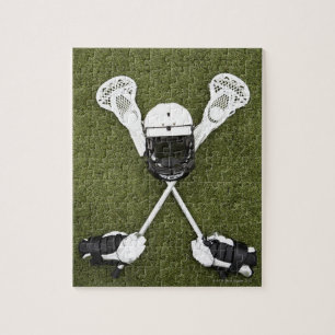 Lacrosse-pinnar, handskar, bollar och hjälm för sp pussel