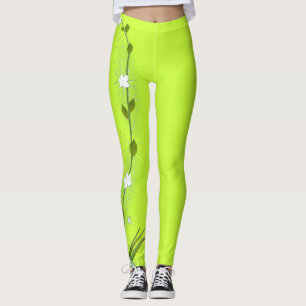Lägger benen på ryggen den gröna damasker för leggings