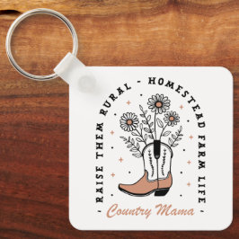 Land mamma mamma höjer dem på landsbygden blommigt nyckelring