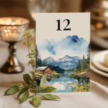 Land Sjö Rustic Barn Watercolor Bröllop Bordsnummer<br><div class="desc">bordsnummer i bröllop med vattenfärgskonstruktion med en charmerande, rustik bröllop-lada som är fastgjord på stränderna av ett stillastående sjö, inramad av stora berg och gräs träd. På scenen med vattenfärger i land fångas en solupplyst dags skönhet, där ladens varma trähuvar speglas perfekt i det stilla vatten. Idealiskt för en rustik...</div>