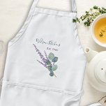 Lavender Eucalyptus Kitchen eller  Bib Apron Förkläde<br><div class="desc">Vit bisapron med eukalyptus löv och en sprit lavender. Anpassa två linjer text och välj mellan två andra färger och storlekar på plattan. Köket namn / kock / business eller annat kan läggas till som översta raden i grått-grönt handskrivet skript. Raden nedan är "Est. with date". Den här plattan stil...</div>