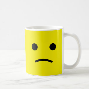 ledset ansikte kaffemugg