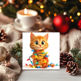 Lekfull kattunge i julgransbelysning julkort