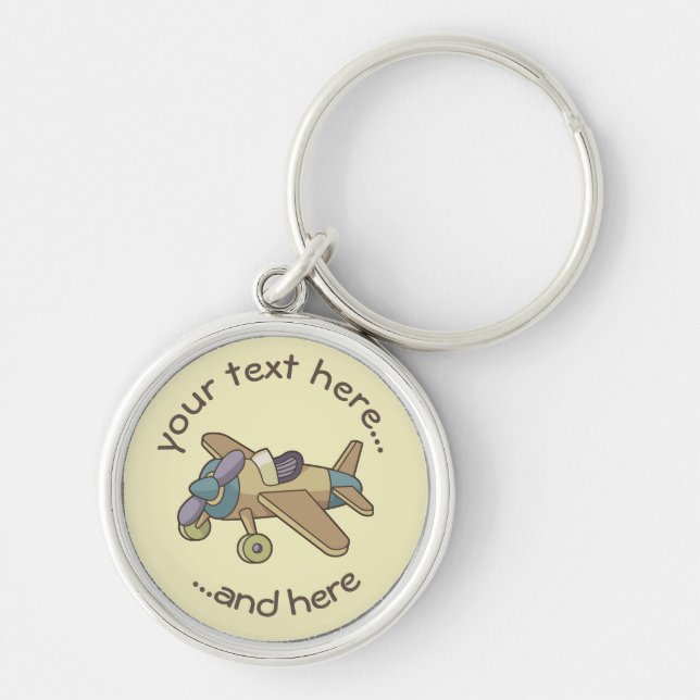 Leksak flygplan rund silverfärgad nyckelring (Framsidan)