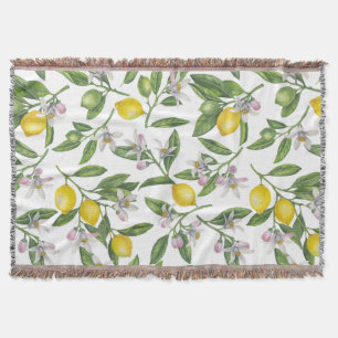Lemon grenar med blommar och frukt på vitt filt