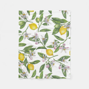 Lemon grenar med blommar och frukt på vitt fleecefilt