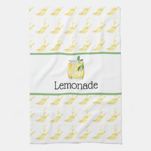 Lemonade i ett glastkökshandduk kökshandduk