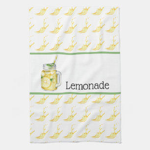 Lemonade i ett glastkökshandduk kökshandduk