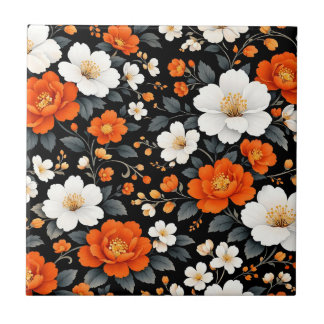 Levande orange och vita blommor på svart kakelplatta
