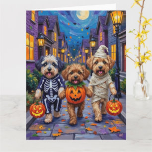 Lhasa Apso busar på godis i halloween-kostymer Kort