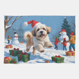 Lhasa Apso springer i snö med julhatt Kökshandduk