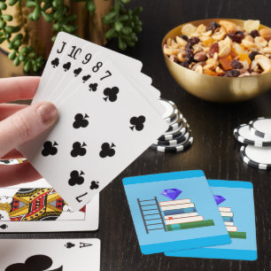 Lila ädelsten på hög med böcker och stege casinokort