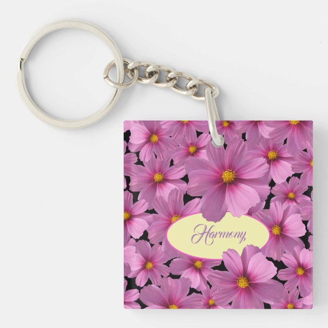 Lila Cosmos blommdesign i en svart bakgrund (Framsidan)