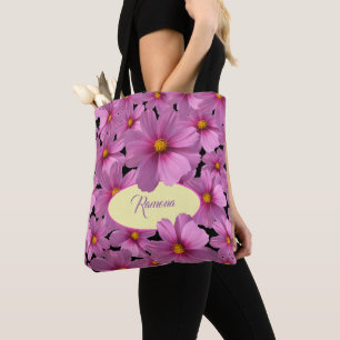 Lila Cosmos blommdesign i en svart bakgrund Tygkasse