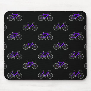 lila-cykel på svart musmatta
