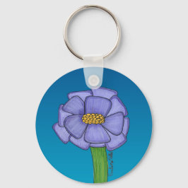 Lila fyrkantig blomma med blå bakgrund nyckelring