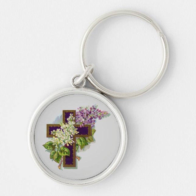 Lila kors och blommor rund silverfärgad nyckelring (Framsidan)