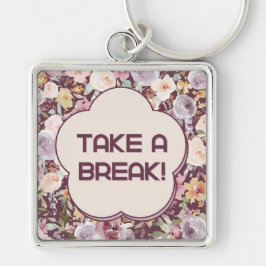 Lila och vit asetisk blomma fyrkantig silverfärgad nyckelring