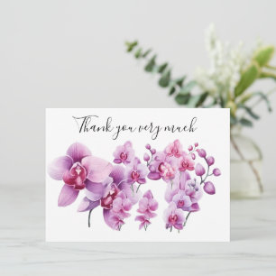 Lila orchid med sten på vit bakgrund tack kort