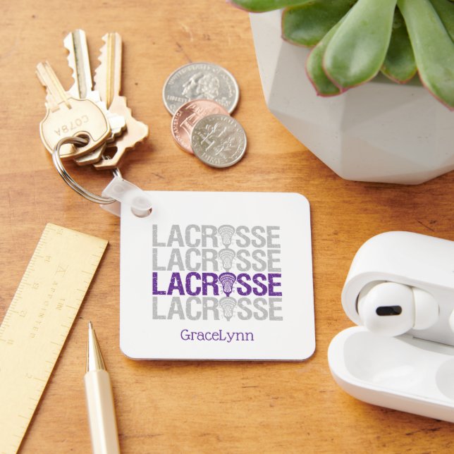 Lila slitna lacrosse-nyckelring med text nyckelring (Skrivbord)