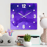 Lila Watercolor Abstrakt med Guld Glitter Stars Fyrkantig Klocka<br><div class="desc">Små guld-stjärnor roterar på lila och mörk blått abstrakt med vattenfärgbakgrund. Lyft upp ditt favoritrum med den här häpnadsväckande,  vibrerande väggklockan. Du kan välja mellan en rund eller fyrkantig klocka ansikte. Gör en underbar hemmavärmargåva! Du kan enkelt anpassa väggklockan. Var snäll och meddela mig med eventuella frågor eller förfrågningar.</div>