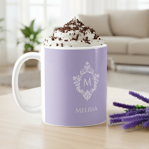 Lilafärgad monogram i en gammal vapensköld lila kaffemugg