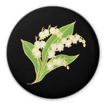 Liljekonvalj på svart beställnings- keramisk knopp