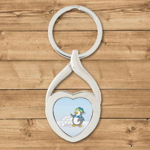 Lilla penguin med snö bollar som viftar twisted heart silverfärgad nyckelring