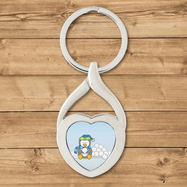 Lilla penguin sitta med snöbullar twisted heart silverfärgad nyckelring (Skapare uppladdad)