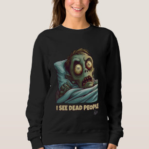 Lilla skrämt zombie i sängen kan se döda människor t shirt