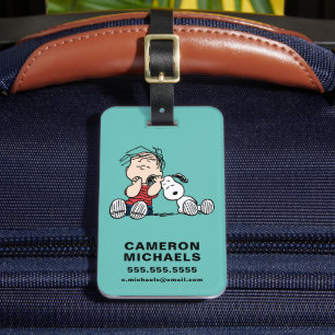 Linus komforterad med soopys öra bagagebricka
