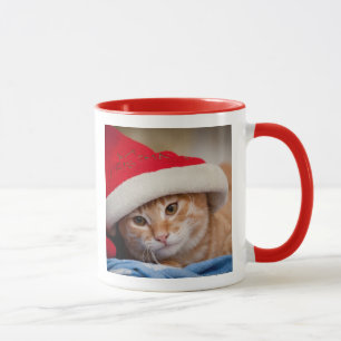 Lite kattunge i röd julhatt mugg