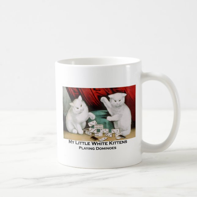 Lite vitkattungar som leker domino kaffemugg (Höger)