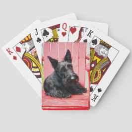 Liten Scottie i en stor röd stol Casinokort
