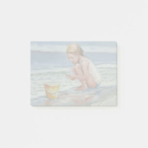 Liten strandskattjägare flicka med gul hink post-it block