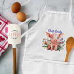 Little Pig in Wildblommor Kids Personlig Apron Barnförkläde<br><div class="desc">Bib apron för ett barn. En söt baby-gris sitta i vildblommorna är designen på den här vita plattan med fickor. Lägg till den unge kockens namn i lila skript över toppen. Använda för gräddning eller för .</div>