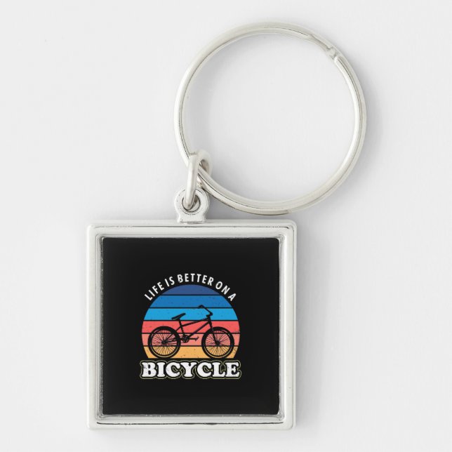 Livet är bättre i en cykel fyrkantig silverfärgad nyckelring (Framsidan)