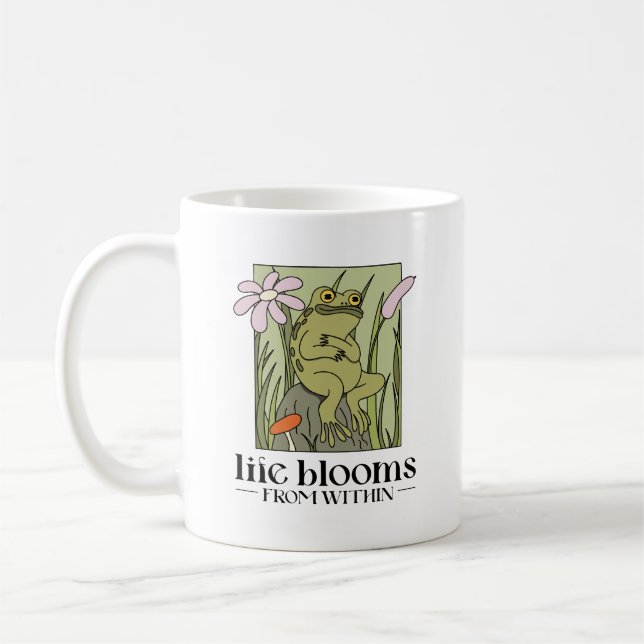 Livet slår ut inifrån kaffemugg (Vänster)