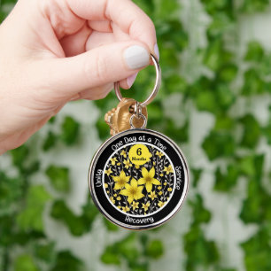 Ljus blomstergåva för speciella nykterhetsmilstole rund silverfärgad nyckelring