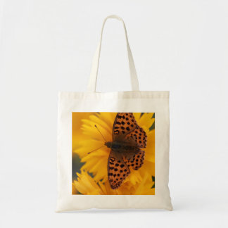 Ljus orange fjäril på gul blomma handväskor tygkasse
