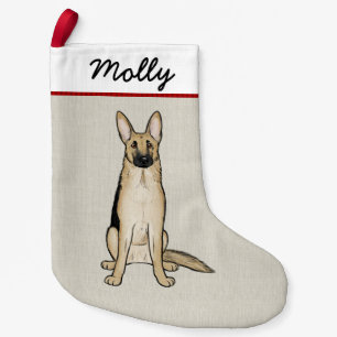 Ljus svart för tysk herdehund och liten julstrumpa