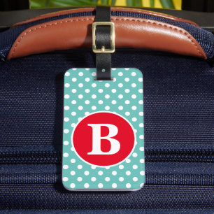 Ljus turkos och vit prickig med röd monogram bagagebricka