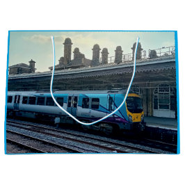 Ljusblått och gult tåg