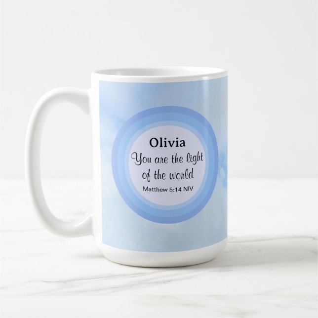 Ljuset på den Baby blue bibeln vid Namn Kaffemugg (Vänster)