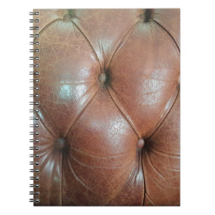 Ljust på brunt läder soffa yta, textureabstra anteckningsbok