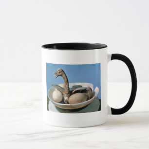 Locket av en alabaster- burk dekorerade med en mugg