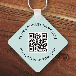 Logotyp, dubbla av QR-kodtext vid sidan ljusblå ak Nyckelring