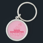 Lola Main Character Energy Rund Silverfärgad Nyckelring<br><div class="desc">Ät strålkastarljuset med Lolas huvudenergi! Den här djärva designen har Lola Bunny som uteslutit förtroende, parad med den tydligare frasen "Main Character Energy". Den slående rosa paletten och den lekfulla typografin gör detta till ett biet i påstående för vilken Looney Tunes fläkt som helst. Anpassa din Zazzle-utrustning - från kläder...</div>
