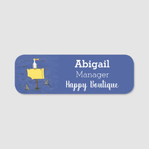 Lönsam havsfågel omringad av hajarnas tecknad namnbricka