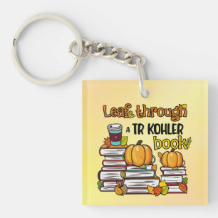 Löv genom en TR Kohler Bok-nyckelkedja